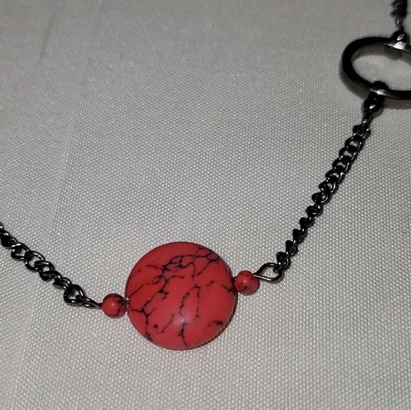 Gunmetal necklace with open shapes adorned with jasper, turquoise, and howlite. - Picture 4 of 9